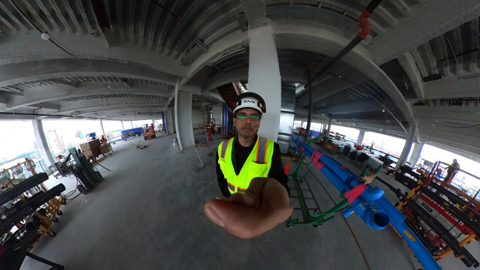 PhD student Vishesh V. Singh with 360 degree camera capturing construction progress data.