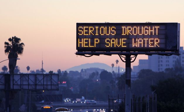 Image of digital highway sign that reads 'SERIOUS DROUGHT HELP SAVE WATER'