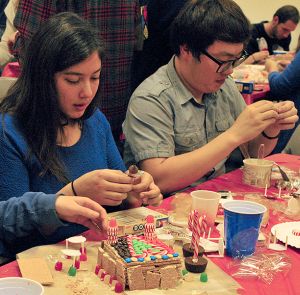 Students building gingerbread houses