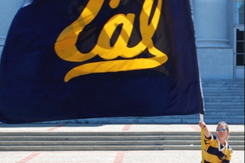 Berkeley student waving Cal flag