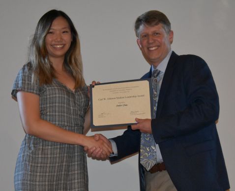 Chair Stacey presents the Carl W. Johnson Student Leadership Award to Amber Chau