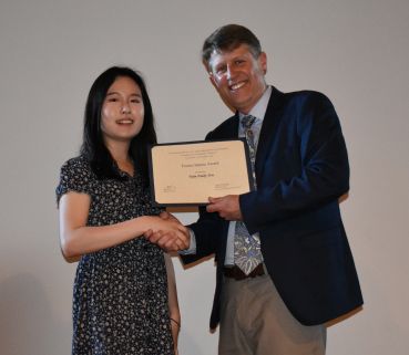 Chair Stacey presents the Tsuneo Sekine Fellowship to Emily You.
