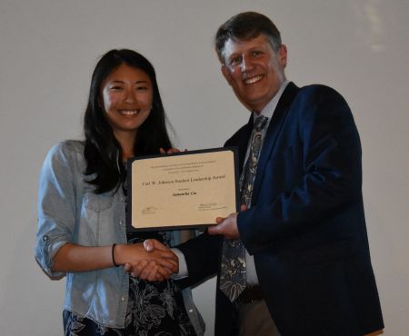 Chair Stacey presents the Carl W. Johnson Student Leadership Award to Samantha Liu.