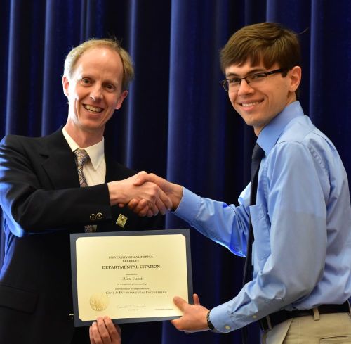 Chair Harley presents the Departmental Citation to Alex Sundt