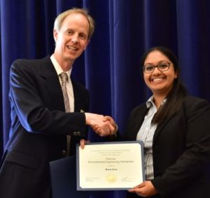 Chair Harley presents the Chevron Scholarship to Meera Kota